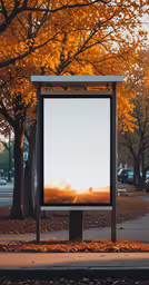 a billboard stands empty in a autumn park