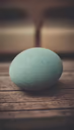 a stone sitting on top of a wooden table