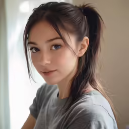 asian girl with hair in high pony tail and lightening out her eyes