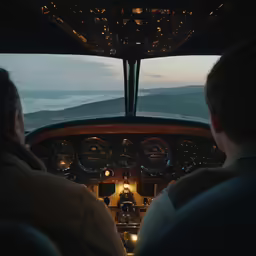a couple of men that are inside a plane