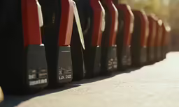 many different types of red and black video cameras on a road