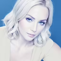 a close up of a person with a light colored outfit on