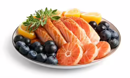 a plate of food including fish, oranges, and blueberries