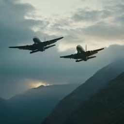 two large planes fly in the air during a cloudy day
