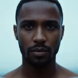 a man with no shirt on posing for a photo