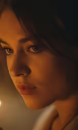 a close up image of a person holding a candle