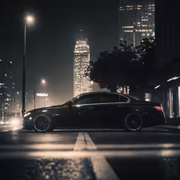 the car is parked along the street at night