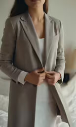 a woman standing on top of a bed next to a bed