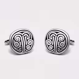 two cufflinkes in the shape of a heart