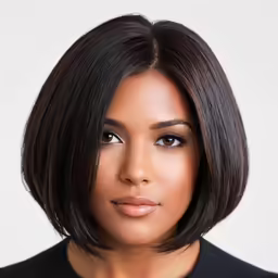 a woman with short hair wearing a black jacket