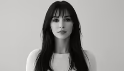 a beautiful young lady wearing a white top