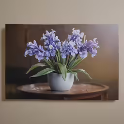 a potted plant with purple flowers sits on top of a table