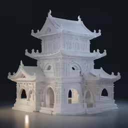 a white building model with windows and arches