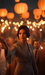 a woman is posing for a photo in front of hanging paper lanterns