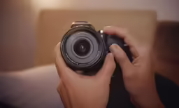 someone using a camera to take a photo