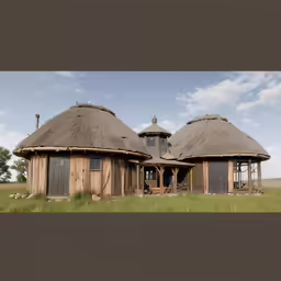 two large round buildings sitting in a field