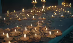 lit candles are sitting in the middle of a walkway