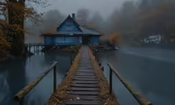 a pier has steps leading to a blue building