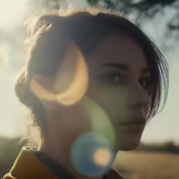 the woman with the yellow coat is staring at something