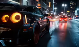 cars are driving down the street in the dark