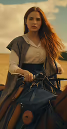 a woman in a medieval costume riding a horse