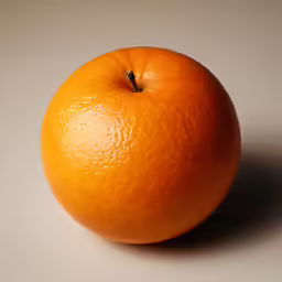 an orange sitting on top of a white surface