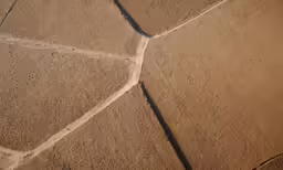 an aerial view of a farm in the middle of nowhere