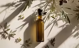 a bottle with some very pretty flowers on it