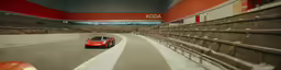 a red sports car driving down a winding road