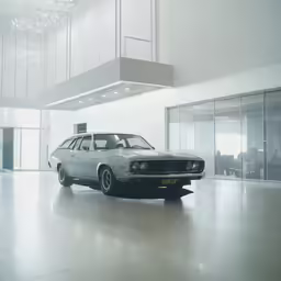 a car parked in a large room with lots of windows