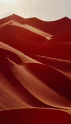 many large dunes in a desert like area