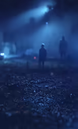 several people standing in the night on a street