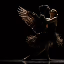 a dancer is holding his arm out and dancing