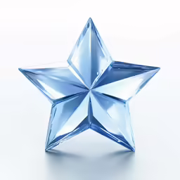 a star shaped glass object sitting on a table