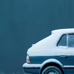 car parked on the snow covered road covered in lots of snow