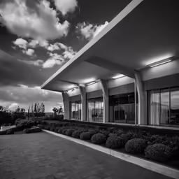 black and white photograph of a courtyard on the side of a building