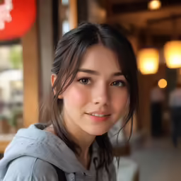 a girl with big blue eyes looking straight ahead