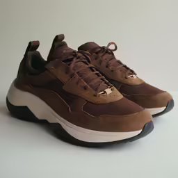 the two toned sneaker in brown has black laces