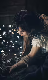 asian woman reaching for something in the water
