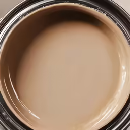 a close up photo of a brown crock with silver stripes on it