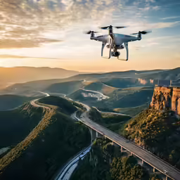 the large propeller flying over the top of a hill