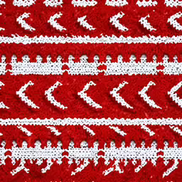 a red knitted table cloth with many arrows on it