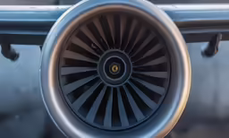 close up of a jet engine at an airport