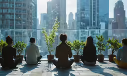 some people sitting in the city looking out on the city