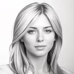 a woman with blond hair wearing a white shirt