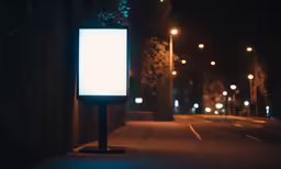 a lit up outdoor billboard at night