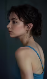 the woman in the photo is staring into the distance