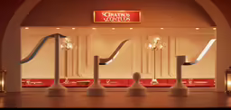 this is a restaurant entrance, with curved booths behind a railing