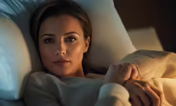 an image of a girl laying in bed