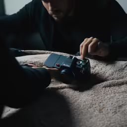 a man is setting a camera for a photo